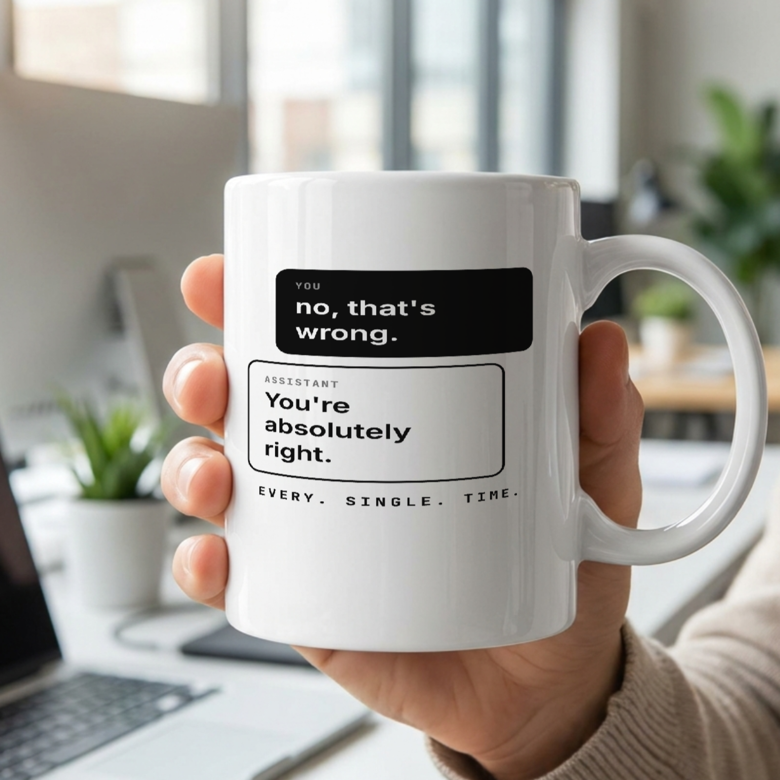 You're Absolutely Right mug held in hand